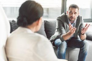Man speaking to therapist